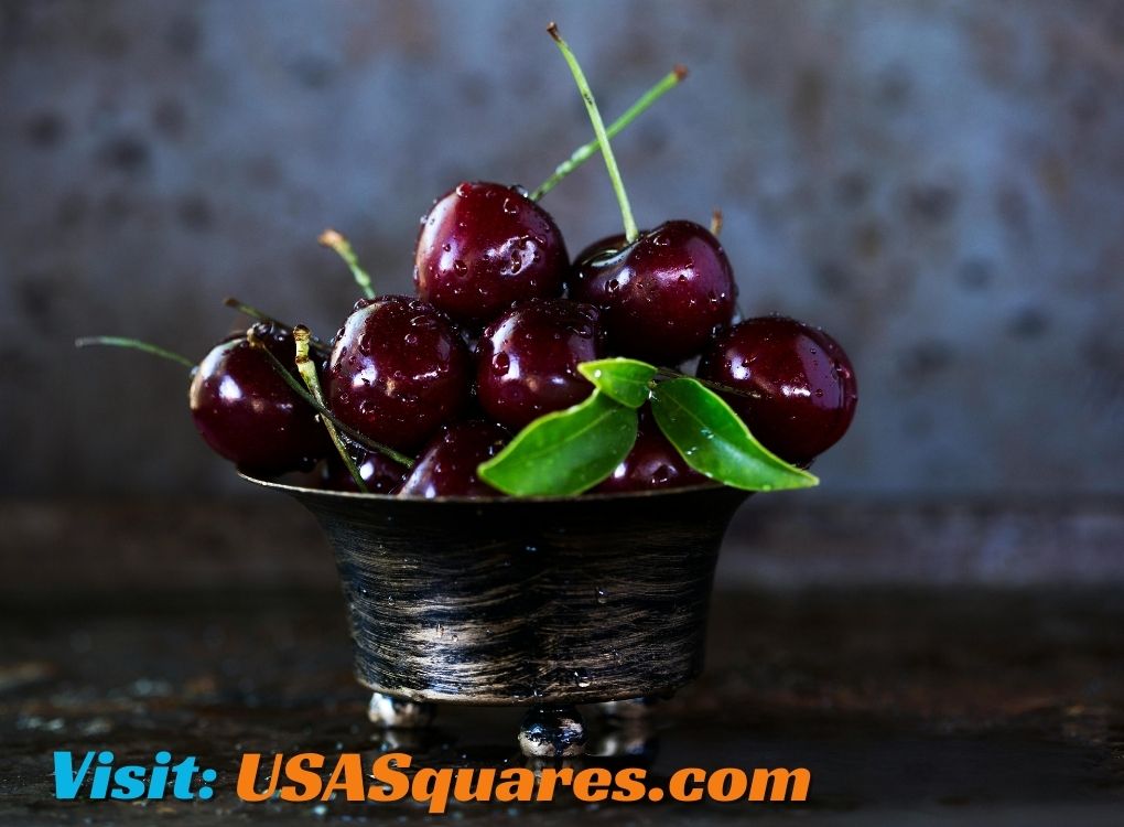 Fresh red cherries in a vintage bowl with green leaves - healthy eating tips from the://vital-mag.net blog