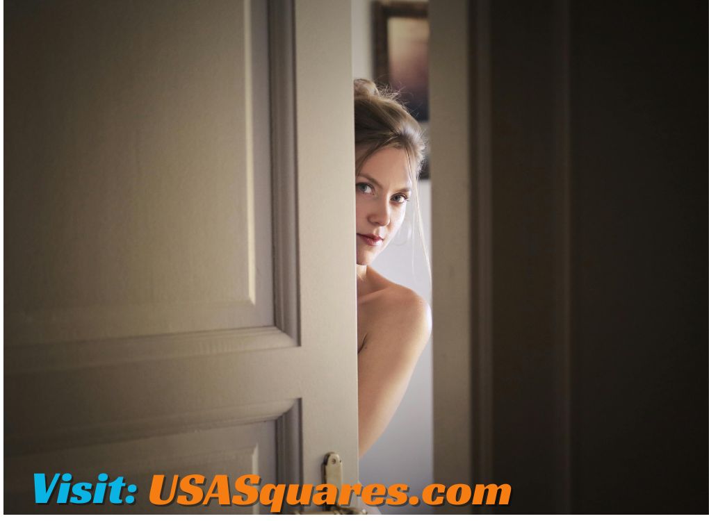 A woman peeking through a door, symbolizing curiosity and engagement - vital-mag.net blog.