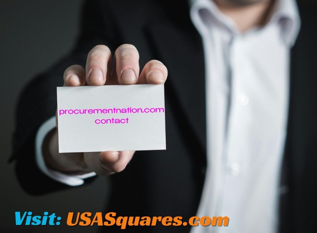 Businessman holding a card with procurementnation.com contact information.