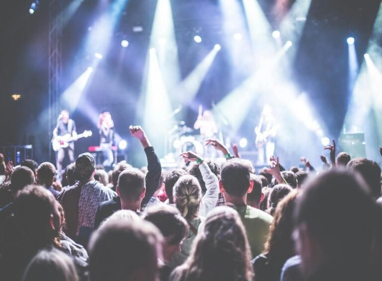 Fans cheering at a live concert during the Deep Purple fake farewell tour, capturing the energy and excitement of this iconic event.