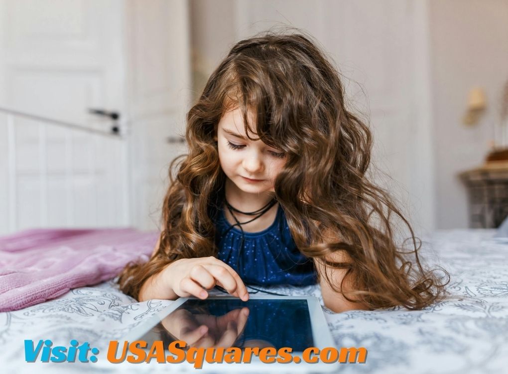 Young girl using a tablet, exploring Lillienu content in a cozy bedroom.